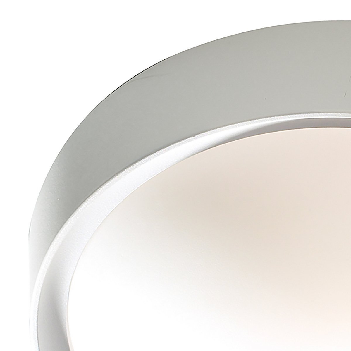 Close-up of a white circular ceiling light from dar lighting.