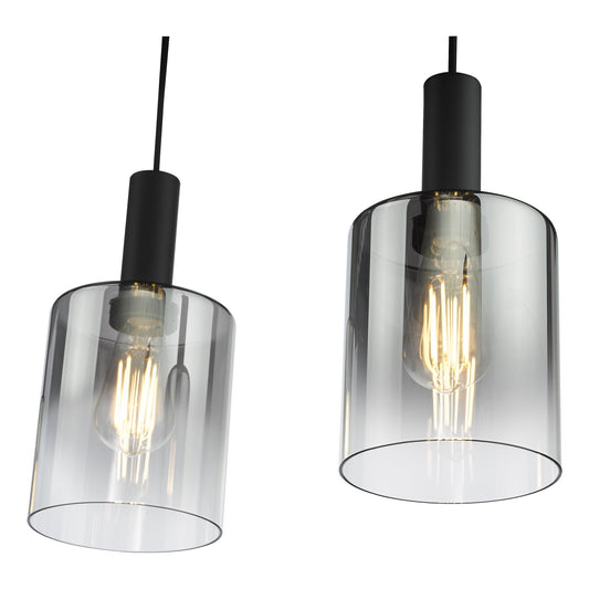 Two dar lighting pendant lights with clear glass shades and black fixtures on a white background