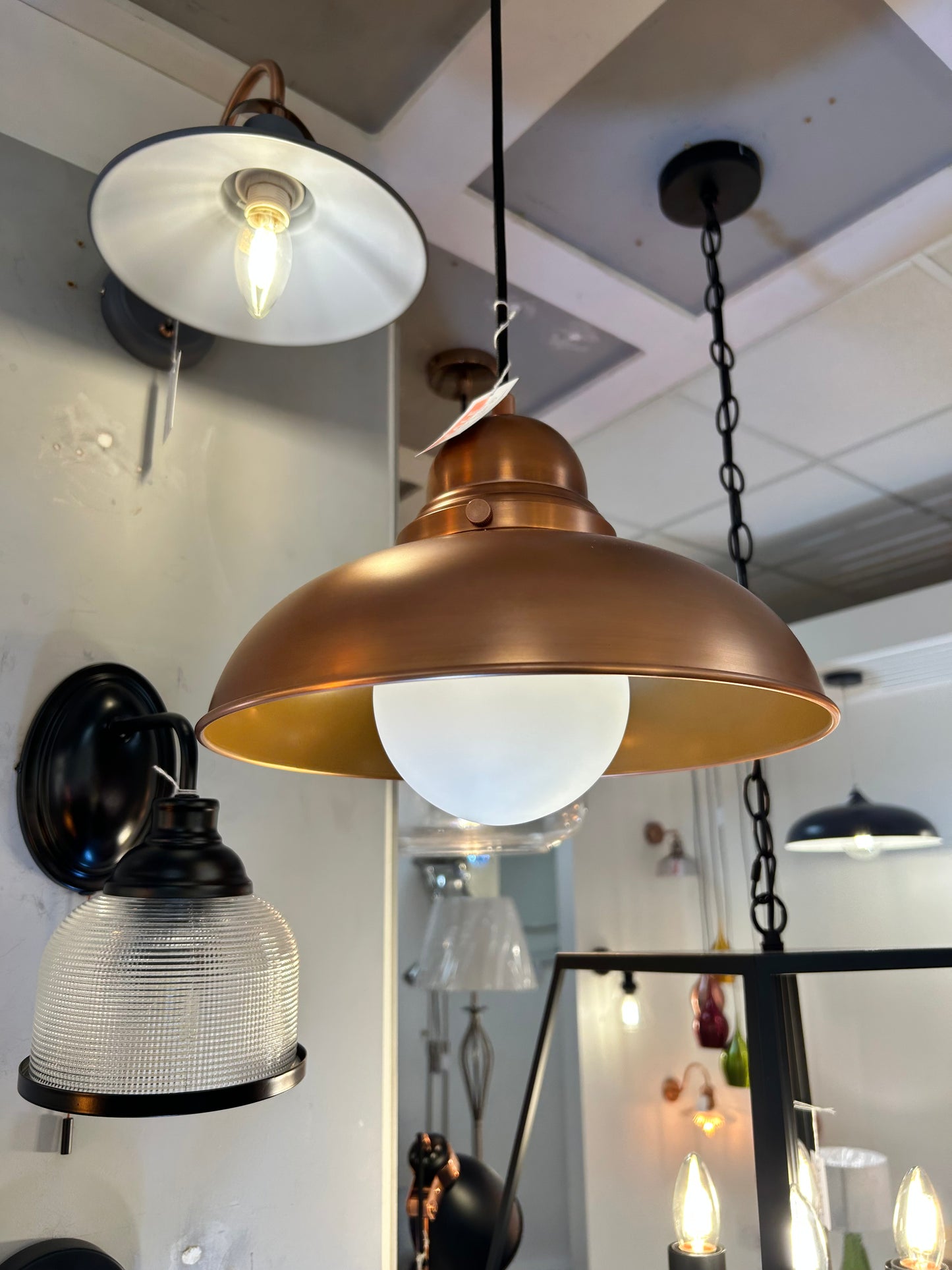 Dar Lighting close-up of industrial-style pendant lights with a focus on design and materials.