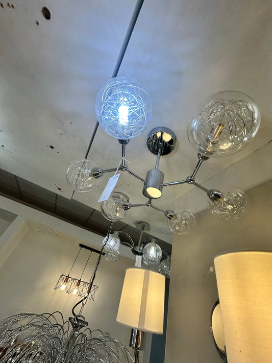 Dar Lighting modern chandelier with glass globe lights on a ceiling