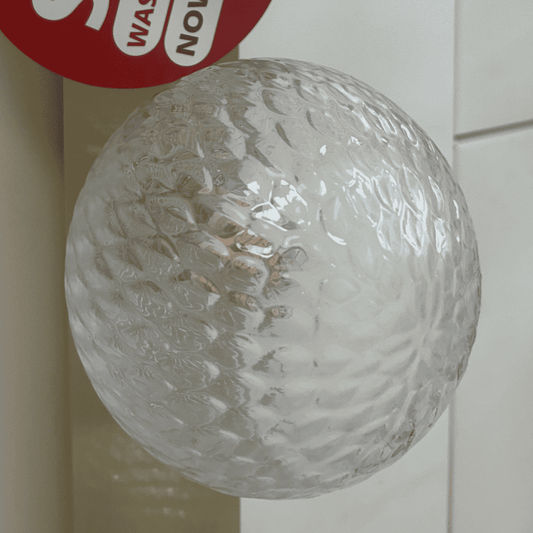 Laura Ashley clear textured ball with a red 'Wash Now' label on a white background