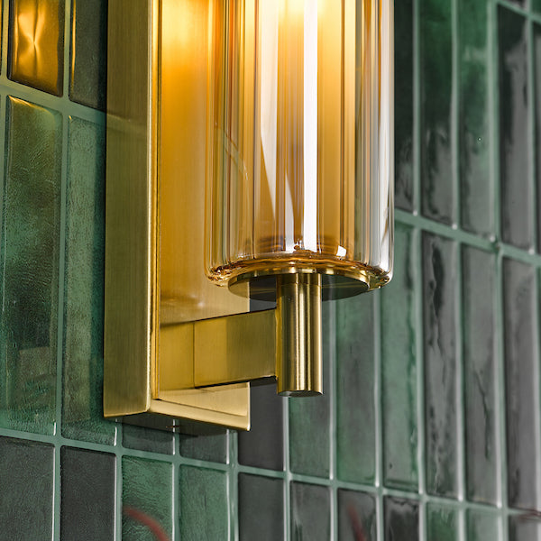 Dar Lighting Bevin Bathroom IP44 Natural Brass & Amber Ribbed Glass Wall Light