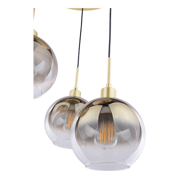 Modern dar lighting pendant light with glass shade and gold fixture on a white background