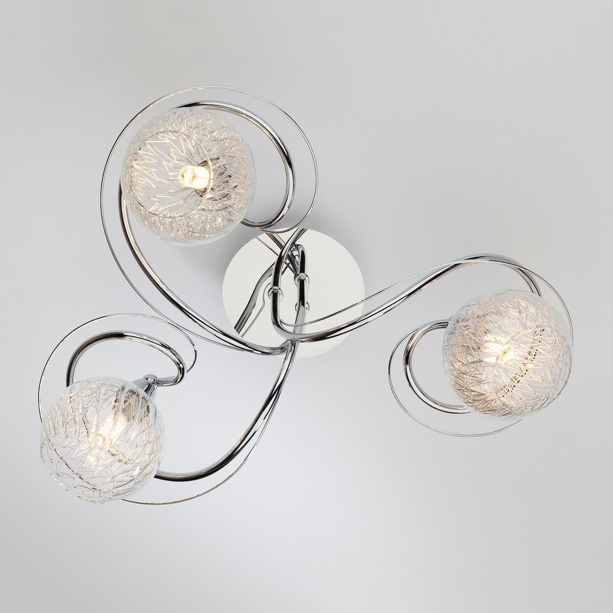Modern dar lighting ceiling light fixture with three glass lampshades on a gray background
