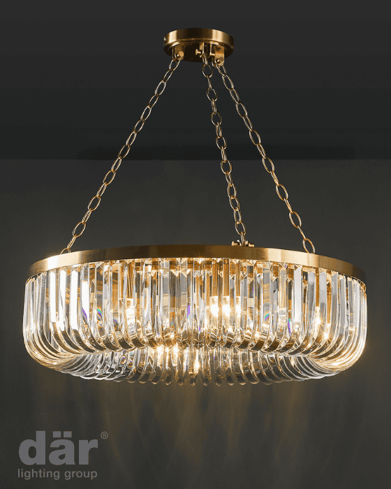Gold chandelier with crystal accents on a dark background, featuring the dar lighting group logo.