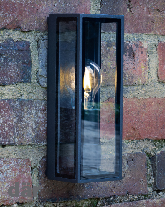 Black outdoor dar lighting wall light fixture on a brick wall