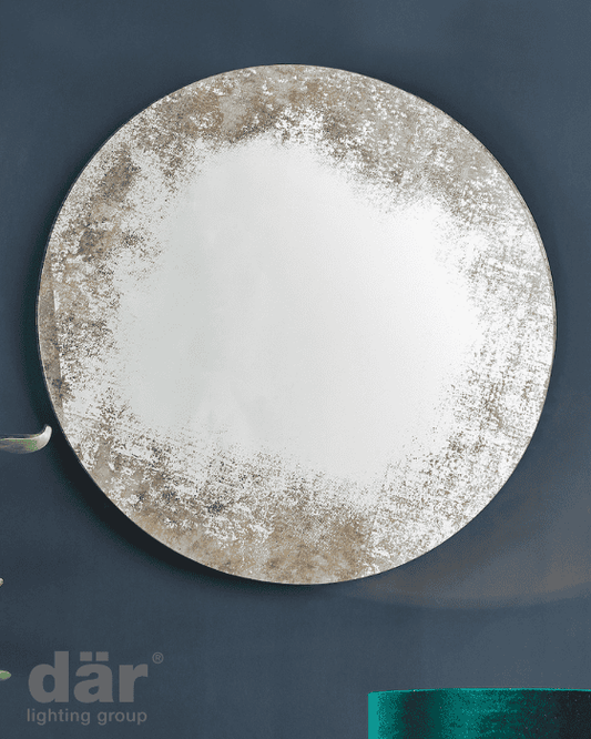 Round decorative dar lighting mirror with textured edge on a dark blue background