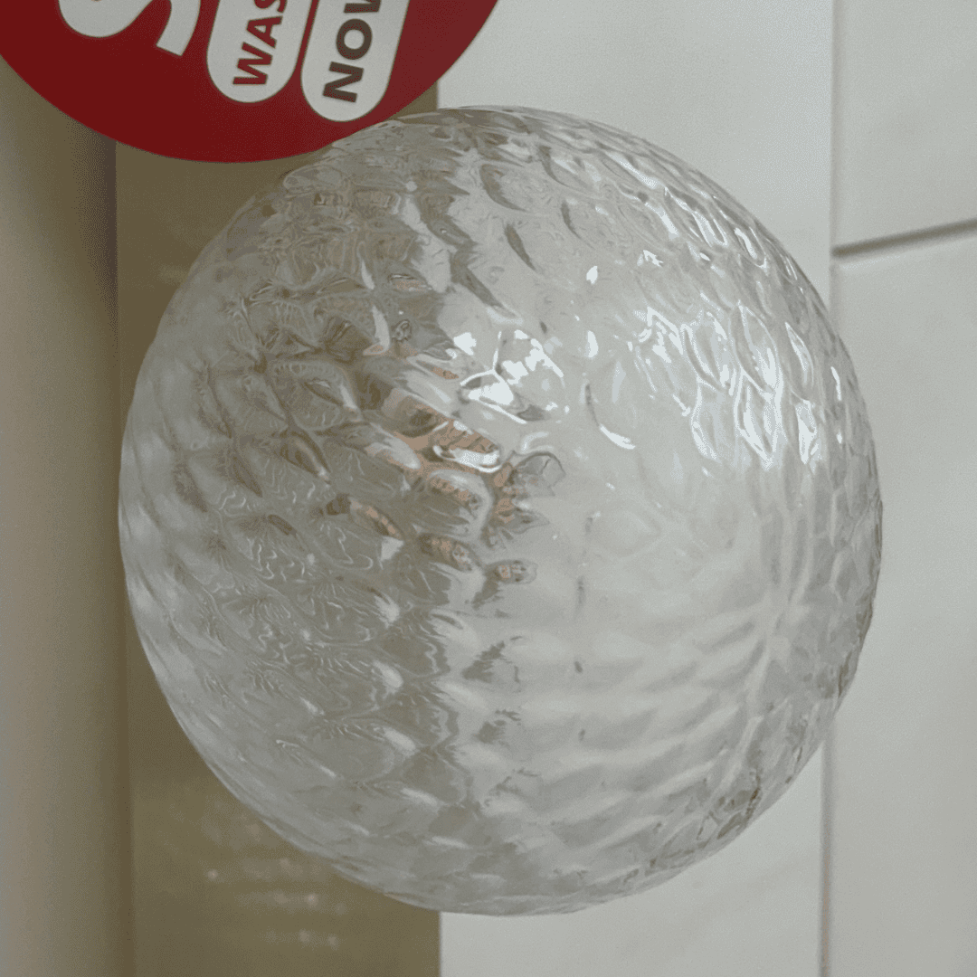 Laura Ashley clear textured ball with a red 'Wash Now' label on a white background