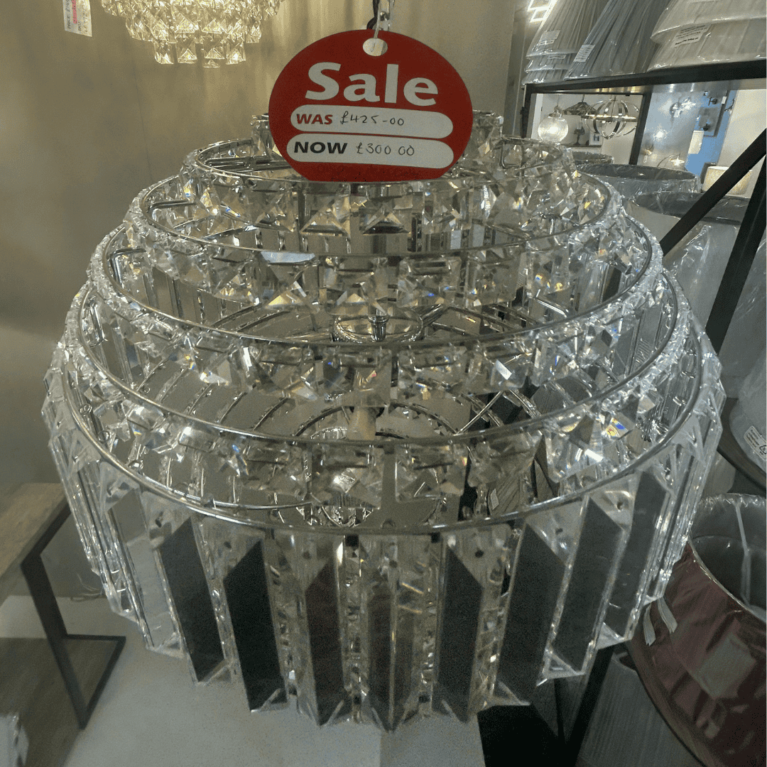 Laura Ashley crystal chandelier with a sale tag indicating a price reduction.