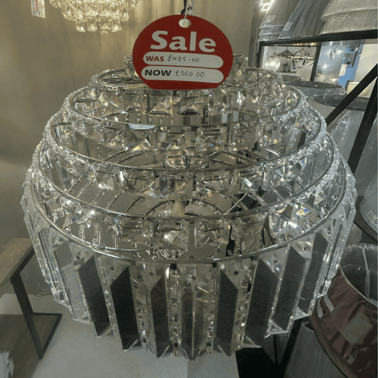 Laura Ashley crystal chandelier with a sale tag indicating a price reduction.