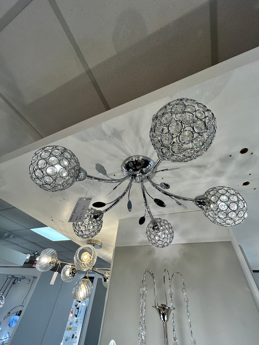 Searchlight decorative chandelier hanging from a ceiling