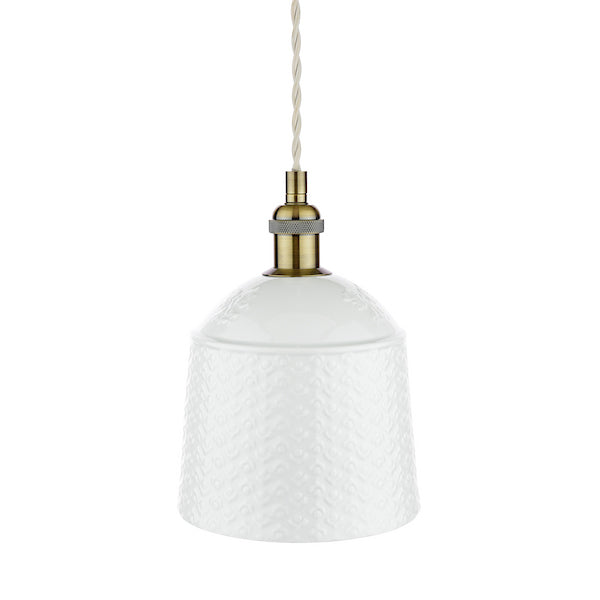 Cream textured pendant light with antique brass fixture on a white background.
